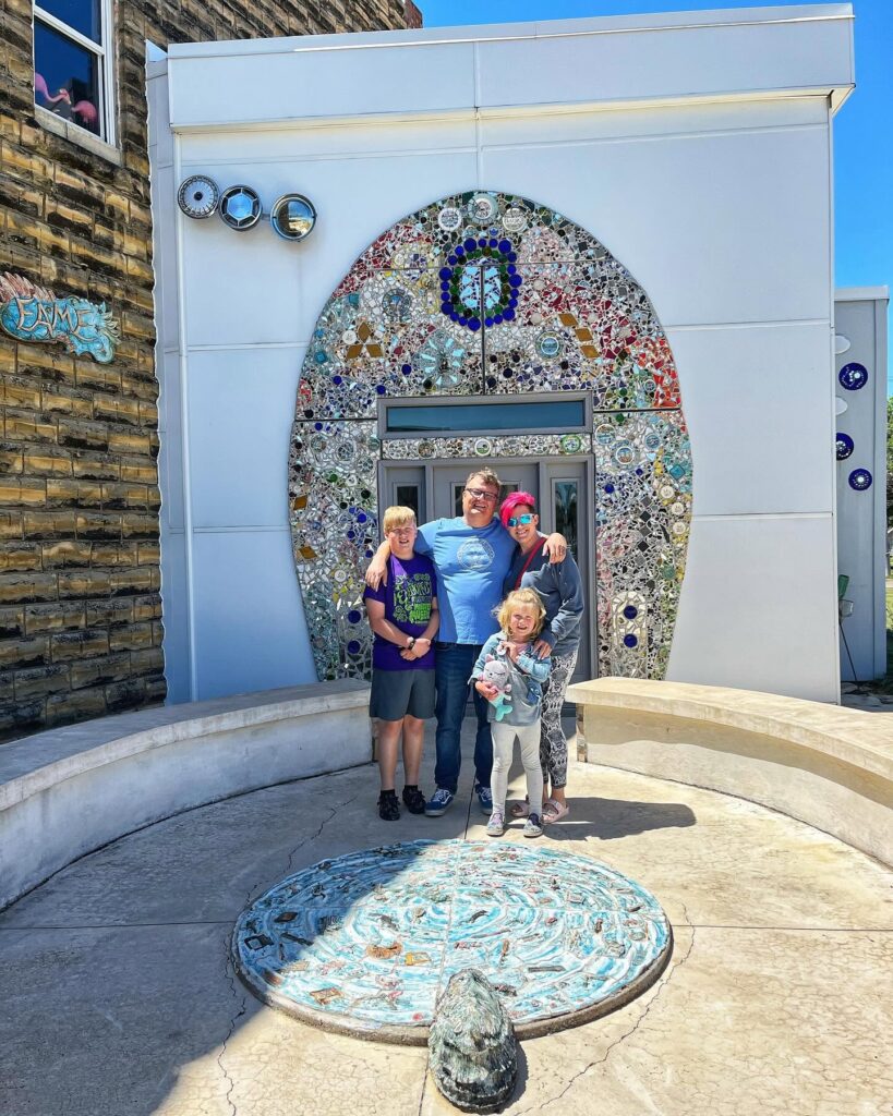 A family in front of the world's largest public restroom.